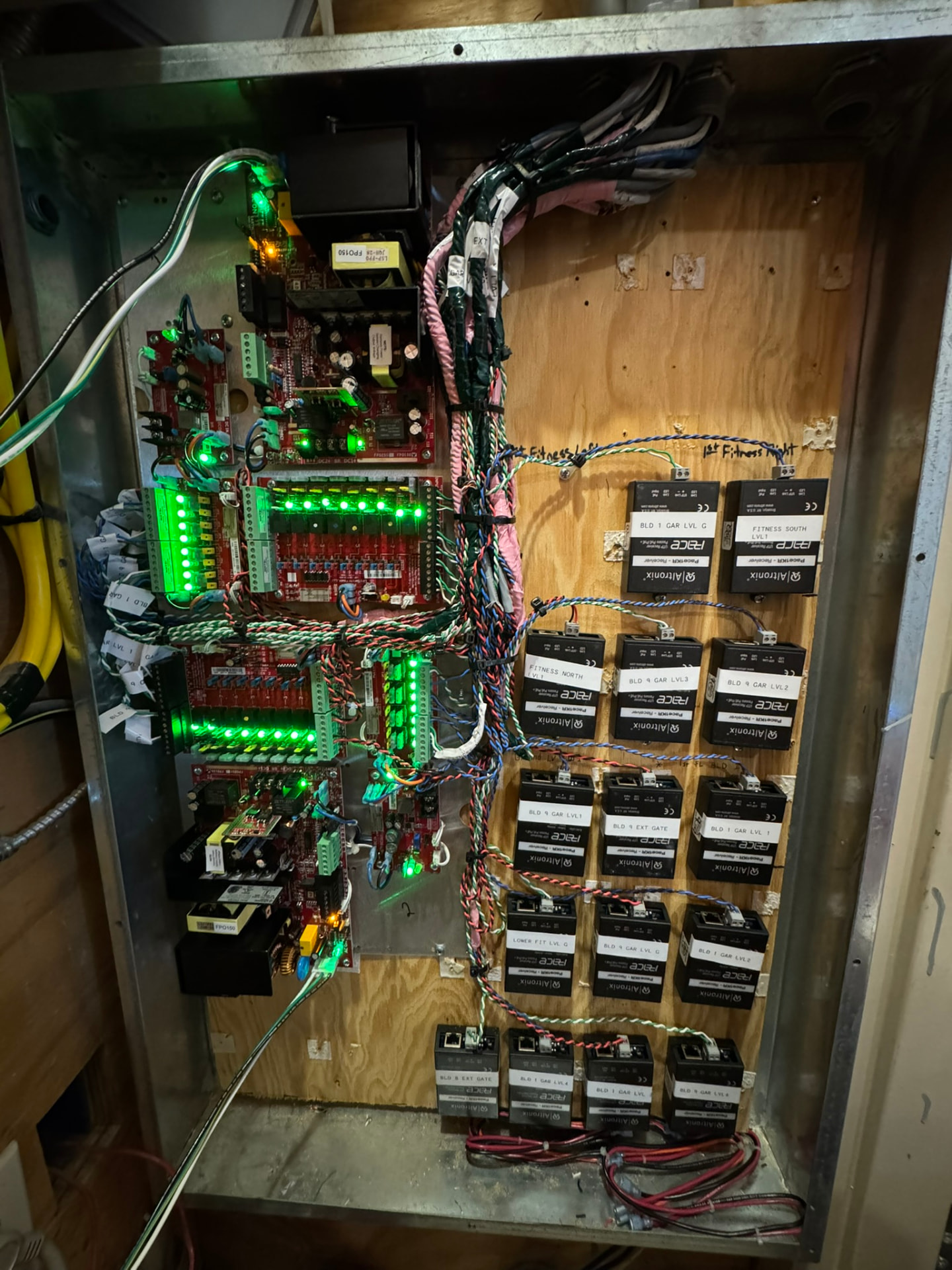 Legacy multi-door access control cabinet with Altronix receiver modules documented by Armor Security Solutions