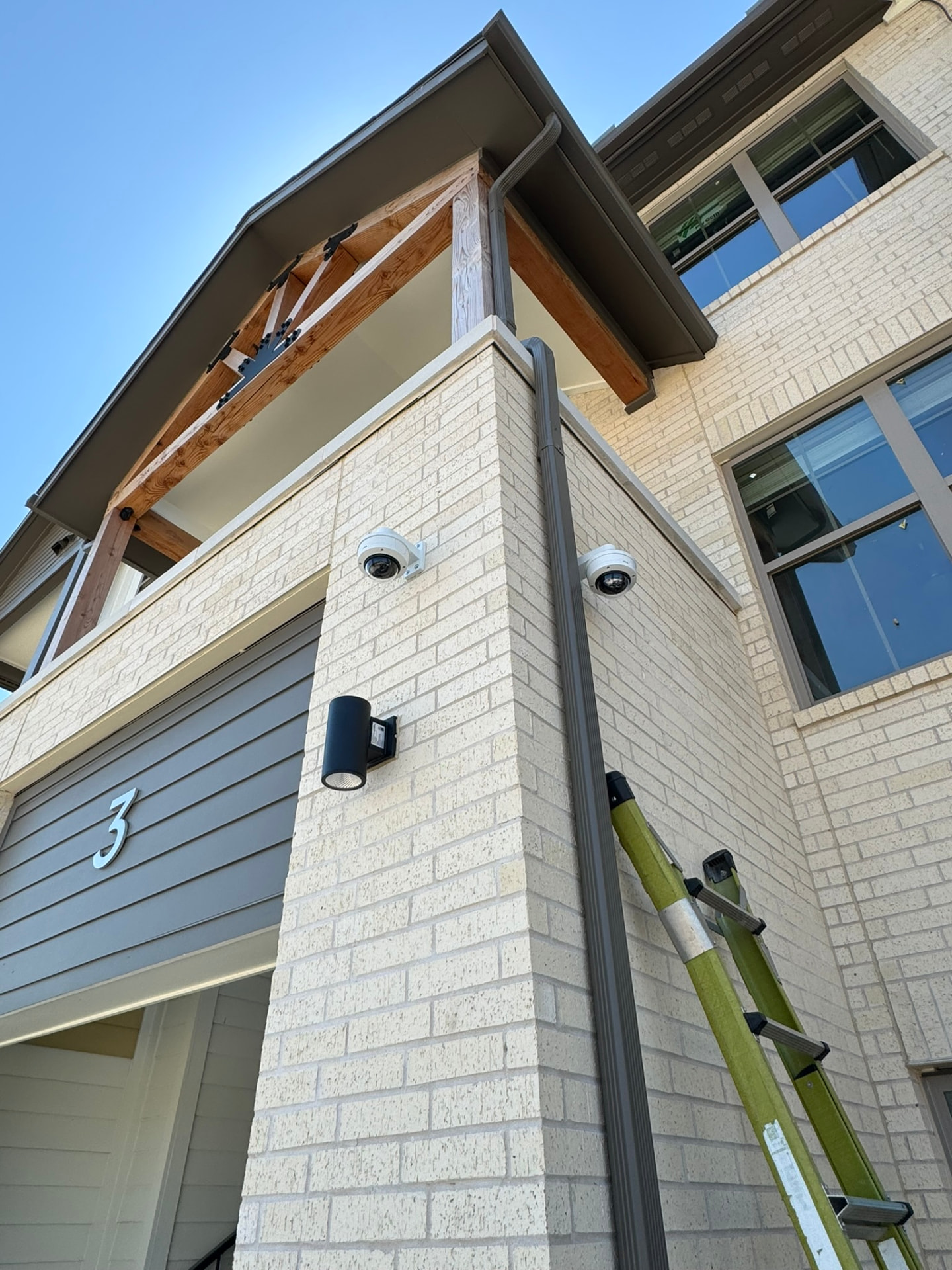 Exterior dome cameras mounted on a building corner by Armor Security Solutions